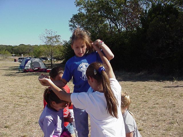 Girls trying to hold up Fiona Cary.JPG